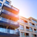 New apartment building on a sunny day. modern residential architecture. the apartment is waiting for new residents.