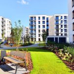 A,Residential,Building,By,Lush,Green,Trees,And,Surrounded,By